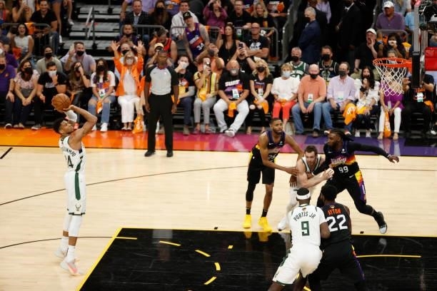 Giannis Antetokounmpo of the Milwaukee Bucks shoots a free throw against the Phoenix Suns during the first half in Game Five of the NBA Finals at...