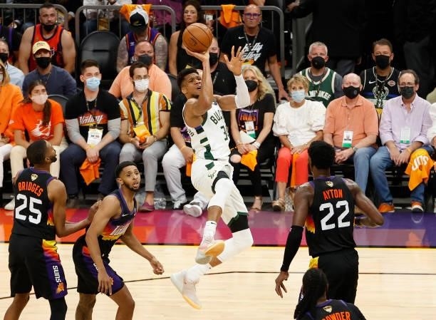 Giannis Antetokounmpo of the Milwaukee Bucks shoots against the Phoenix Suns during the first half in Game Five of the NBA Finals at Footprint Center...