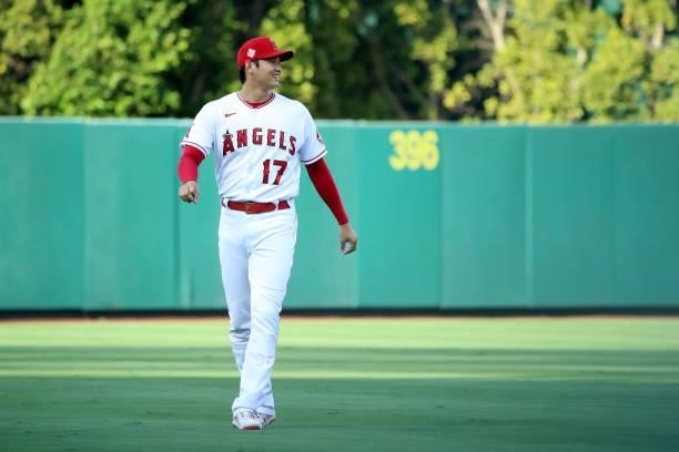 Shohei Ohtani of the Los Angeles Angels looks on before the game against the Seattle Mariners at Angel Stadium of Anaheim on July 17, 2021 in...