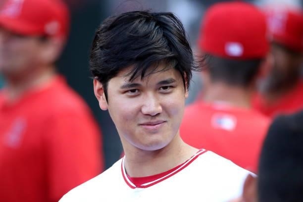 Shohei Ohtani of the Los Angeles Angels looks on from the dugout before the game against the Seattle Mariners at Angel Stadium of Anaheim on July 17,...