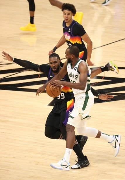 Khris Middleton of the Milwaukee Bucks drives against Jae Crowder of the Phoenix Suns during the first half in Game Five of the NBA Finals at...