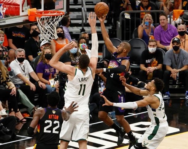 Chris Paul of the Phoenix Suns goes up for a shot against Brook Lopez of the Milwaukee Bucks during the first half in Game Five of the NBA Finals at...