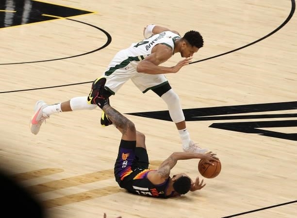 Giannis Antetokounmpo of the Milwaukee Bucks fouls Cameron Payne of the Phoenix Suns during the first half in Game Five of the NBA Finals at...