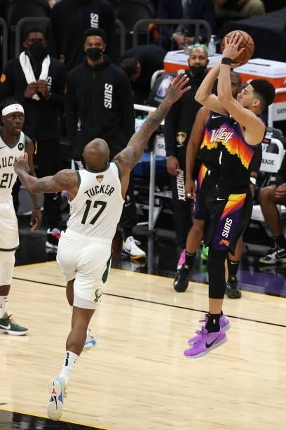 Devin Booker of the Phoenix Suns shoots against P.J. Tucker of the Milwaukee Bucks during the second half in Game Five of the NBA Finals at Footprint...