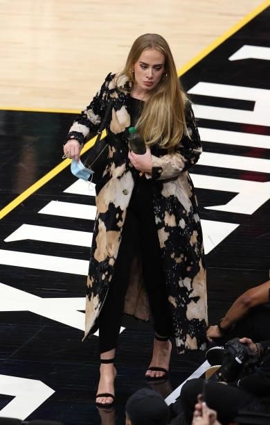 Singer Adele looks walks in during the second half in Game Five of the NBA Finals between the Milwaukee Bucks and the Phoenix Suns at Footprint...
