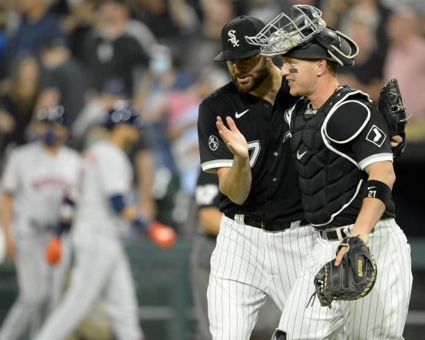 Lucas Giolito celebrates with Zack Collins of the Chicago White Sox after pitching a complete game against the Houston Astros on July 17, 2021 at...