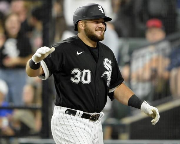 Jake Burger of the Chicago White Sox reacts after hitting his first Major League home run in the seventh inning against Austin Pruitt of the Houston...