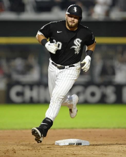 Jake Burger of the Chicago White Sox runs the bases after hitting his first Major League home run in the seventh inning against Austin Pruitt of the...