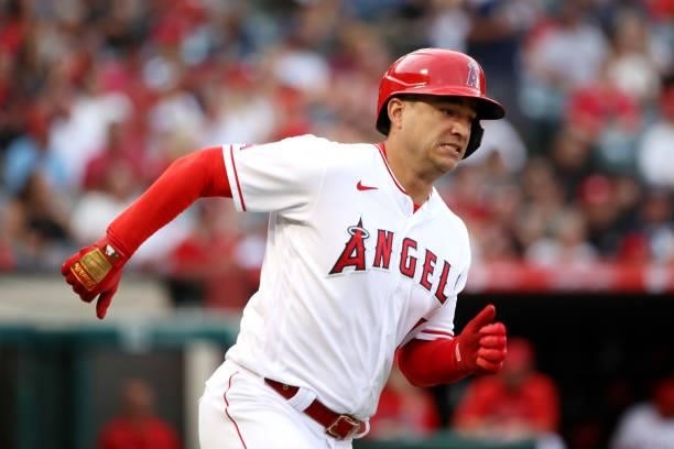 Jose Iglesias of the Los Angeles Angels runs to first base after hitting a double during the third inning against the Seattle Mariners at Angel...