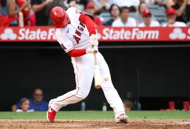 Taylor Ward of the Los Angeles Angels hits an RBI double to score in Jose Iglesias during the third inning against the Seattle Mariners at Angel...