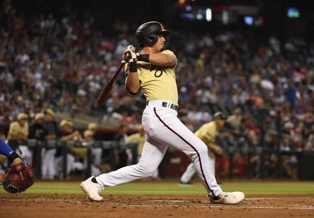 Josh Rojas of the Arizona Diamondbacks follows through on a swing against the Chicago Cubs at Chase Field on July 16, 2021 in Phoenix, Arizona.
