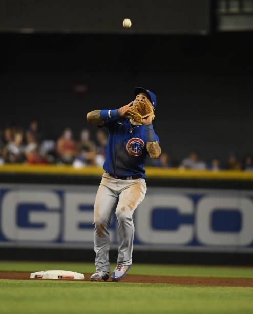 Javier Baez of the Chicago Cubs catches a pop fly against the Arizona Diamondbacks at Chase Field on July 16, 2021 in Phoenix, Arizona.