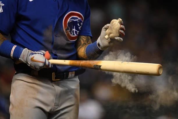 Javier Baez of the Chicago Cubs prepares his bat prior to stepping into the batters box against the Arizona Diamondbacks at Chase Field on July 16,...