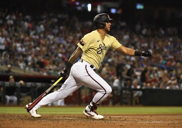 David Peralta of the Arizona Diamondbacks follows through on a swing against the Chicago Cubs at Chase Field on July 16, 2021 in Phoenix, Arizona.