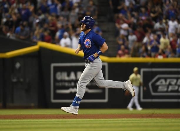 Patrick Wisdom of the Chicago Cubs rounds the bases after hitting a home run against the Arizona Diamondbacks at Chase Field on July 16, 2021 in...