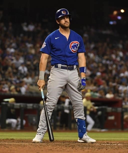 Patrick Wisdom of the Chicago Cubs reacts after being called out on strikes by home plate umpire Lance Barksdale during the eighth inning against the...