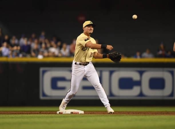 Josh Rojas of the Arizona Diamondbacks makes a throw to first base against the Chicago Cubs at Chase Field on July 16, 2021 in Phoenix, Arizona.