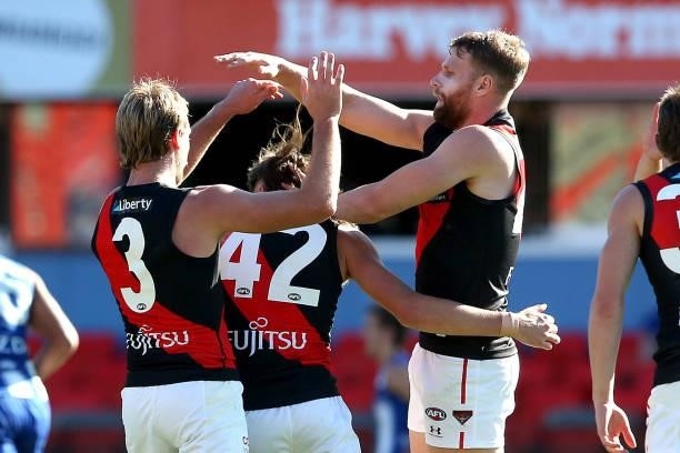 Jake Stringer of the Bombers celebrates a goal during the round 18 AFL match between North Melbourne Kangaroos and Essendon Bombers at Metricon...