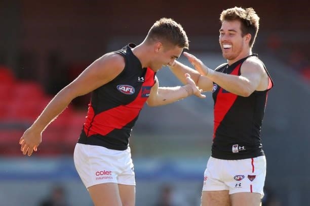 Matt Guelfi of Essendon celebrates his goal during the round 18 AFL match between North Melbourne Kangaroos and Essendon Bombers at Metricon Stadium...