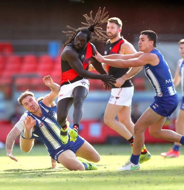 Anthony McDonald-Tipungwuti of Essendon kicks the ball during the round 18 AFL match between North Melbourne Kangaroos and Essendon Bombers at...
