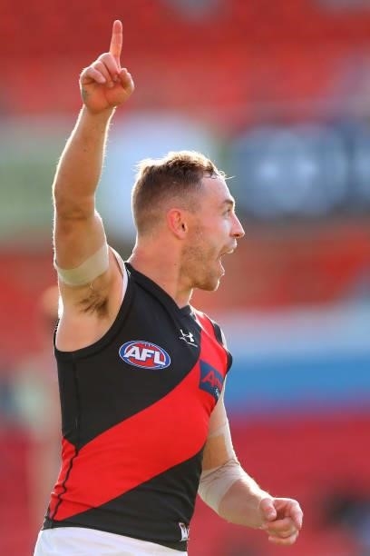 Devon Smith of Essendon celebrates during the round 18 AFL match between North Melbourne Kangaroos and Essendon Bombers at Metricon Stadium on July...
