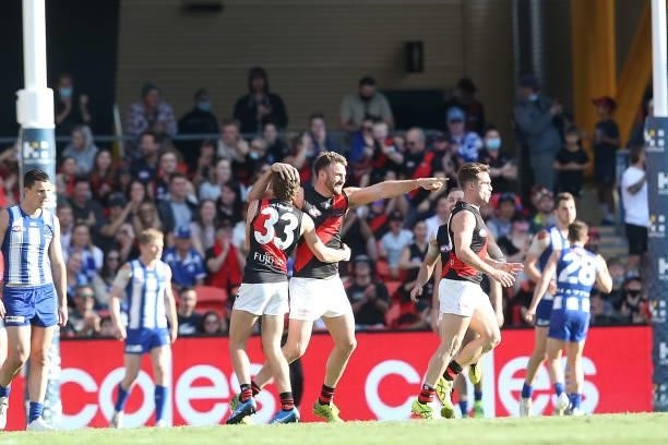 Jake Stringer of the Bombers celebrates a goal during the round 18 AFL match between North Melbourne Kangaroos and Essendon Bombers at Metricon...