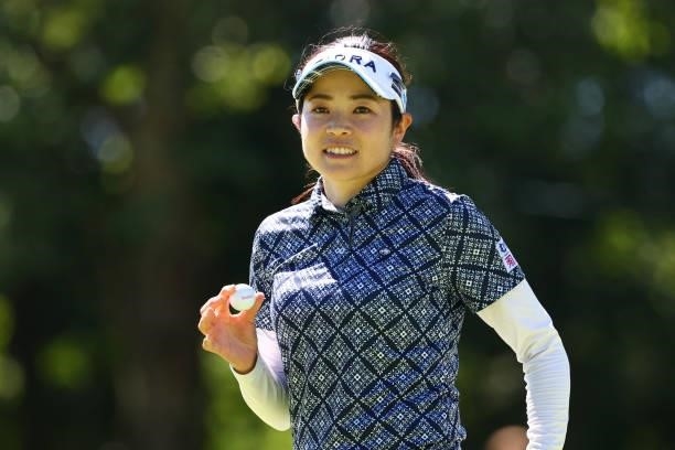 Sumika Nakasone of Japan acknowledges fans after holing out with the birdie on the 18th green during third round of the GMO Internet Ladies Samantha...