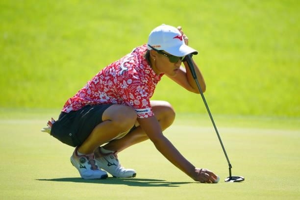 Mao Nozawa of Japan lines up a putt on the 17th green during third round of the GMO Internet Ladies Samantha Thavasa Global Cup at Eagle Point Golf...