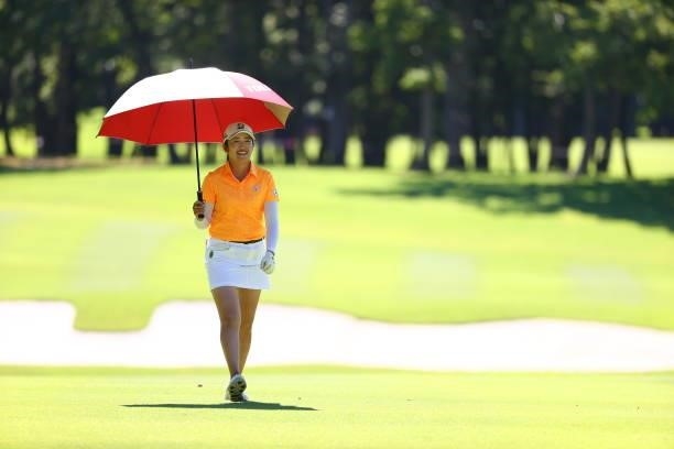 Mone Inami of Japan smiles while walking on the 18th fairway during third round of the GMO Internet Ladies Samantha Thavasa Global Cup at Eagle Point...
