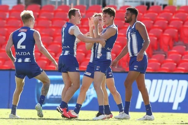 Curtis Taylor of the Kangaroos celebrates a goal during the round 18 AFL match between North Melbourne Kangaroos and Essendon Bombers at Metricon...