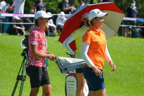 Maiko Wakabayashi and Mao Nozawa of Japan are seen after holing out on the 18th green during final round of the GMO Internet Ladies Samantha Thavasa...
