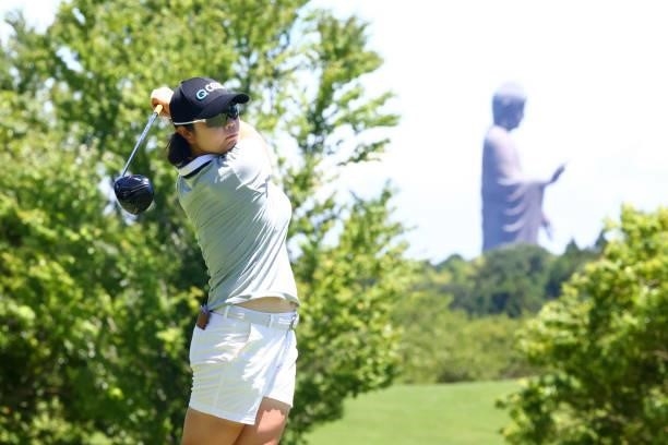Min-young Lee of South Korea hits her tee shot 11th hole where a giant buddha statue is seen during third round of the GMO Internet Ladies Samantha...