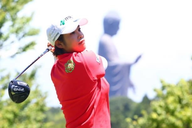 Mayu Hamada of Japan hits her tee shot 11th hole where a giant buddha statue is seen during third round of the GMO Internet Ladies Samantha Thavasa...