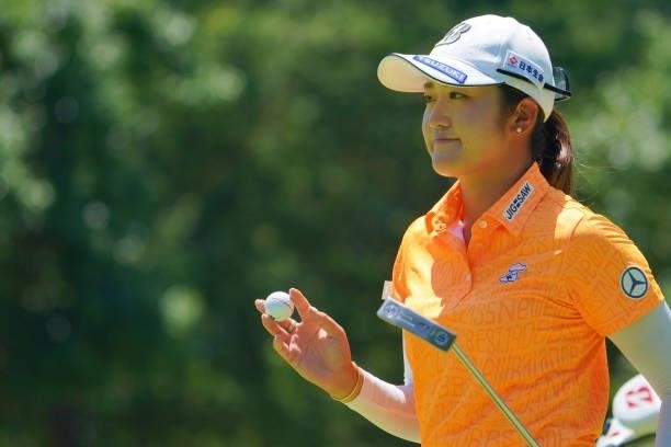 Mone Inami of Japan acknowledges fans on the 8th green during third round of the GMO Internet Ladies Samantha Thavasa Global Cup at Eagle Point Golf...