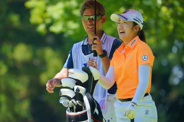 Mone Inami of Japan laughs on the 8th green during third round of the GMO Internet Ladies Samantha Thavasa Global Cup at Eagle Point Golf Club on...