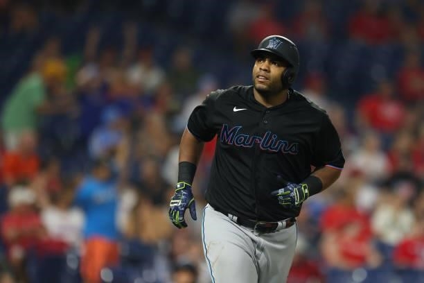 Jesus Aguilar of the Miami Marlins hits a two-run home run against the Philadelphia Phillies during the ninth inning of a game at Citizens Bank Park...
