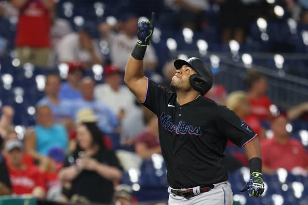 Jesus Aguilar of the Miami Marlins gestures after he hit a two-run home run against the Philadelphia Phillies during the ninth inning of a game at...