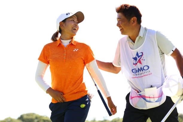 Maiko Wakabayashi of Japan is congratulated by her caddie after winning the tournament on the 18th green on the playoff second hole during final...