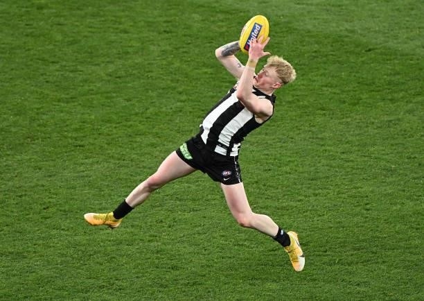 John Noble of the Magpies marks during the round 18 AFL match between Collingwood Magpies and Carlton Blues at Melbourne Cricket Ground on July 18,...