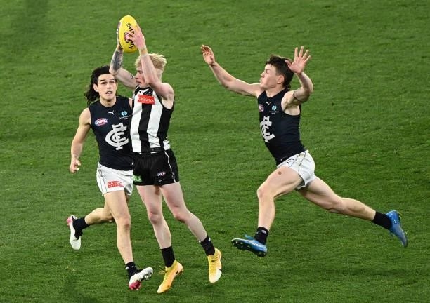 John Noble of the Magpies marks during the round 18 AFL match between Collingwood Magpies and Carlton Blues at Melbourne Cricket Ground on July 18,...