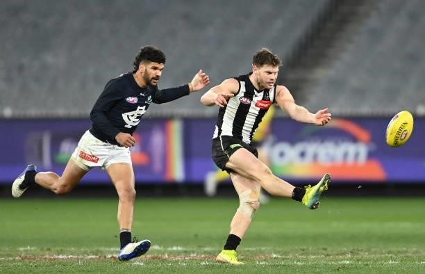 Taylor Adams of the Magpies kicks the ball during the round 18 AFL match between Collingwood Magpies and Carlton Blues at Melbourne Cricket Ground on...