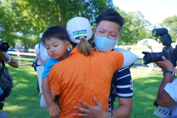 Winner Maiko Wakabayashi of Japan is congratulated by her husband and son after winning the tournament following final round of the GMO Internet...