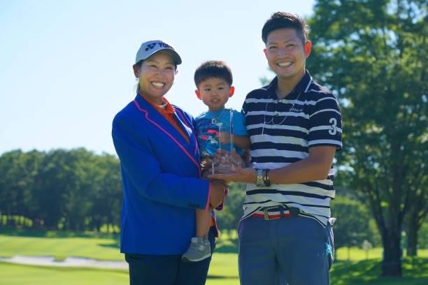Winner Maiko Wakabayashi of Japan poses with her husband and son after winning the tournament following final round of the GMO Internet Ladies...