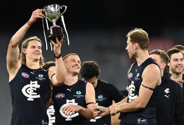 Tom De Koning of the Blues is seen with the Peter Mac Cup after the Blues defeated the Magpies during the round 18 AFL match between Collingwood...