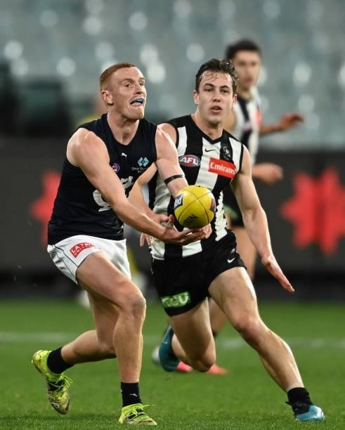 Matthew Cottrell of the Blues handballs during the round 18 AFL match between Collingwood Magpies and Carlton Blues at Melbourne Cricket Ground on...