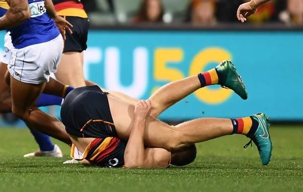 Nick Murray of the Crows flys high over Jack Darling of the Eagles but lands and injures himself during the round 18 AFL match between Adelaide Crows...