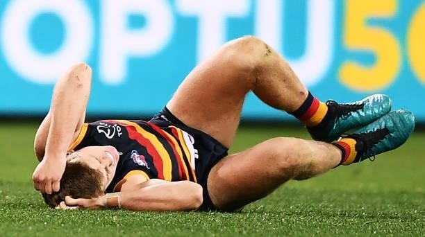Nick Murray of the Crows after flying high over Jack Darling of the Eagles but lands and injures himself during the round 18 AFL match between...