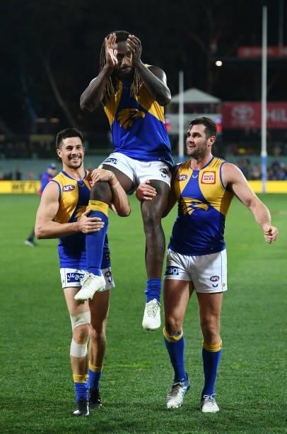Nic Naitanui of the Eagles chaired off for his 200th game during the round 18 AFL match between Adelaide Crows and West Coast Eagles at Adelaide Oval...