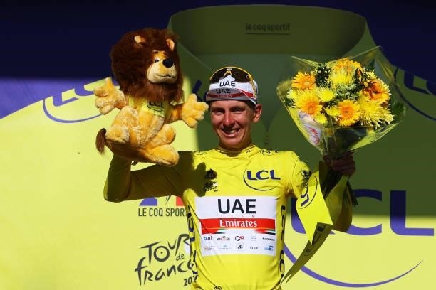 Tadej Pogačar of Slovenia and UAE-Team Emirates yellow leader jersey celebrates at podium during the 108th Tour de France 2021, Stage 20 a 30,8km...