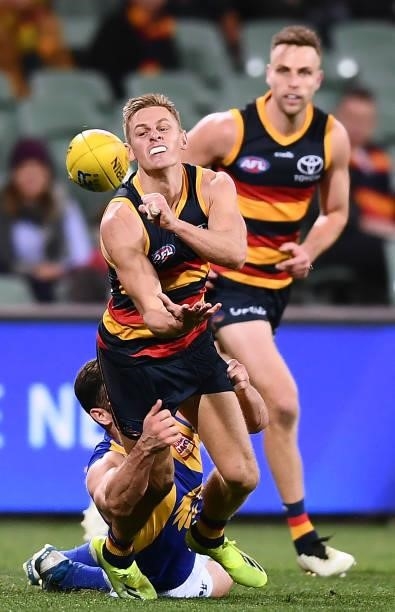 David Mackay of the Crows handballs during the round 18 AFL match between Adelaide Crows and West Coast Eagles at Adelaide Oval on July 18, 2021 in...